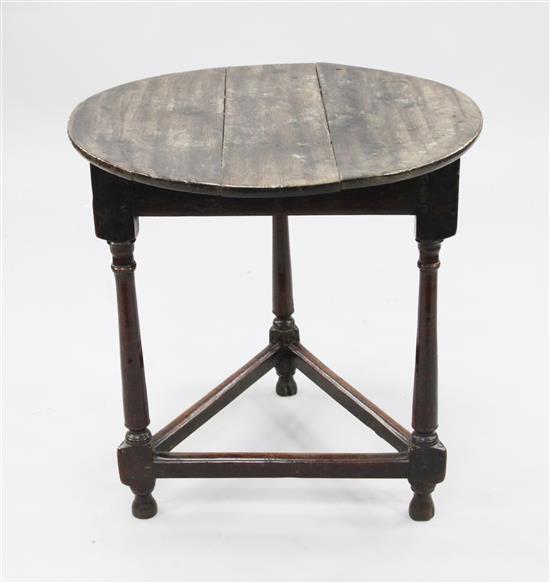 An 18th century circular fruitwood and oak cricket table, W.2ft 2in.